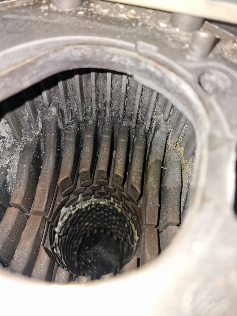 Deposits inside the heat exchanger reduced efficiency and required cleaning.